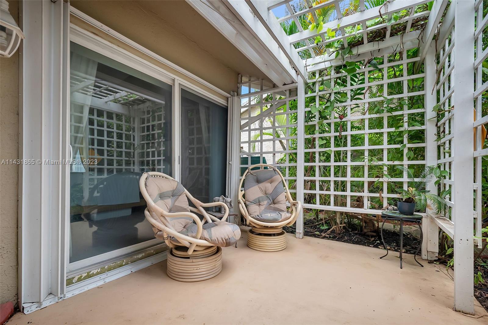 13120 Southwest 117th Street Miami, FL 33186 - Photo 28 of 29 a view of a chair and fire pit in patio with a backyard