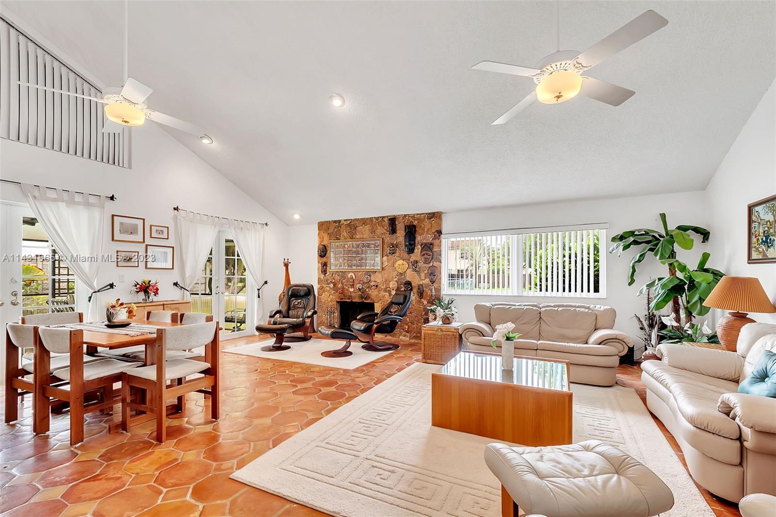 13120 Southwest 117th Street Miami, FL 33186 - Photo 3 of 29 a living room with furniture dining area and a large window
