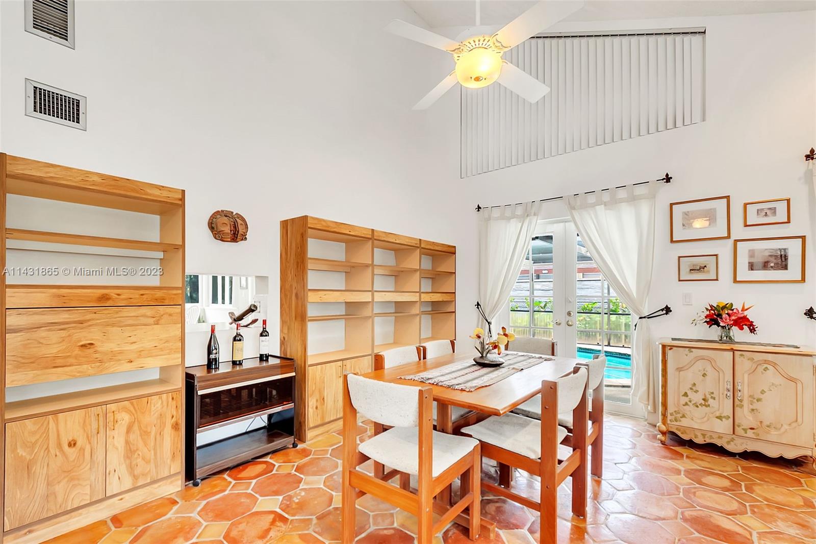 13120 Southwest 117th Street Miami, FL 33186 - Photo 4 of 29 a view of a dining room with furniture and a chandelier