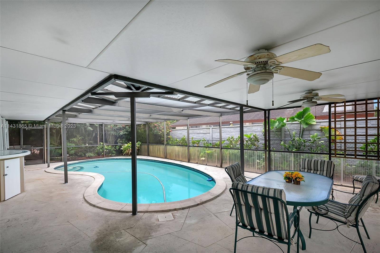 13120 Southwest 117th Street Miami, FL 33186 - Photo 8 of 29 a view of a swimming pool and a porch