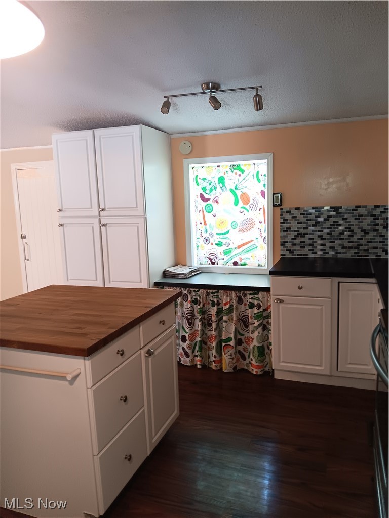 76241 Old Twenty One Road Kimbolton, OH 43749 - Photo 12 of 36 Kitchen featuring butcher block countertops, white cabinets, and dark wood finished floors