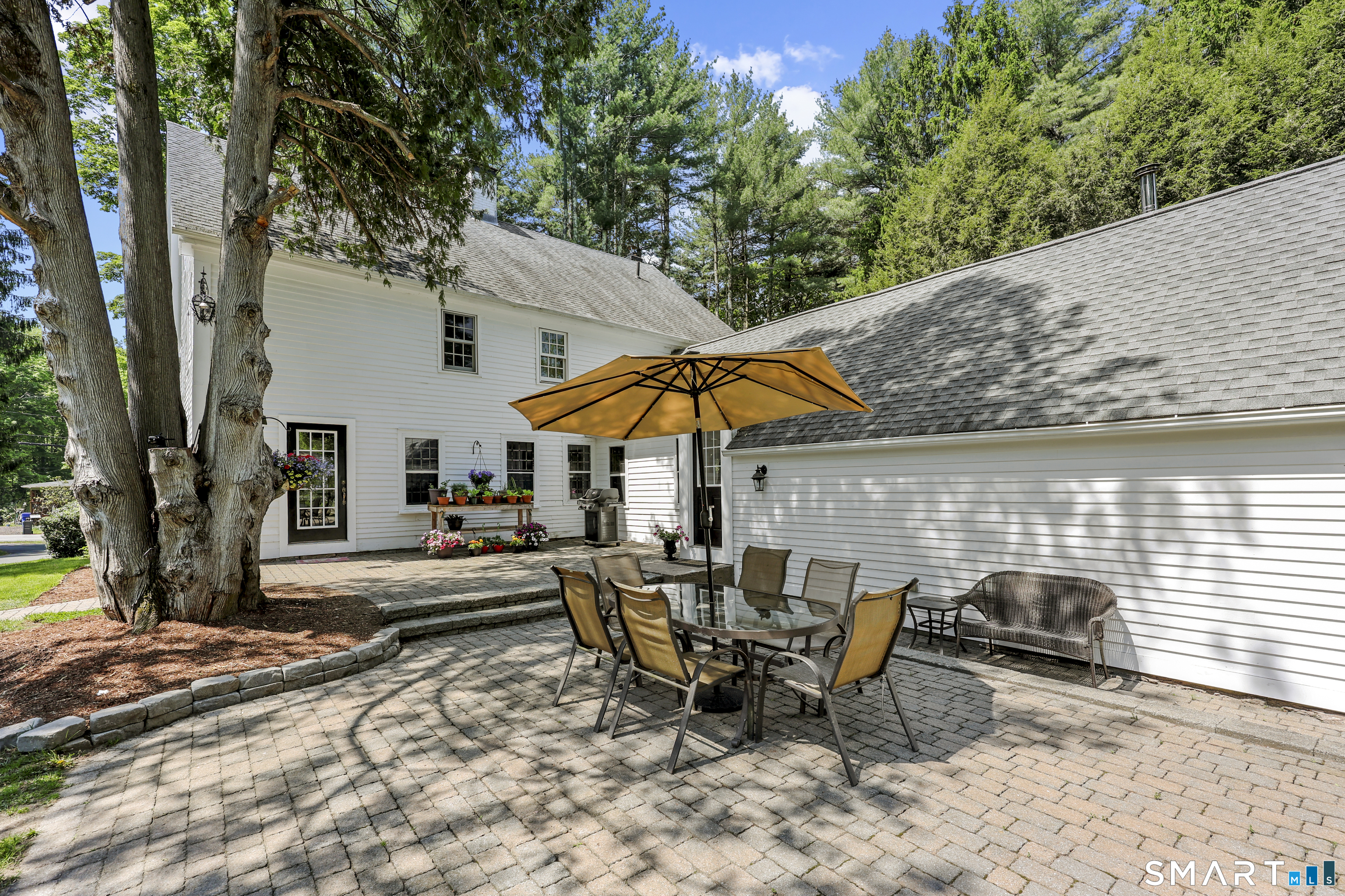 2880 Main Street Coventry, CT 06238 - Photo 5 of 40 Expansive patio with direct access to kitchen offers wonderful indoor/outdoor flow.