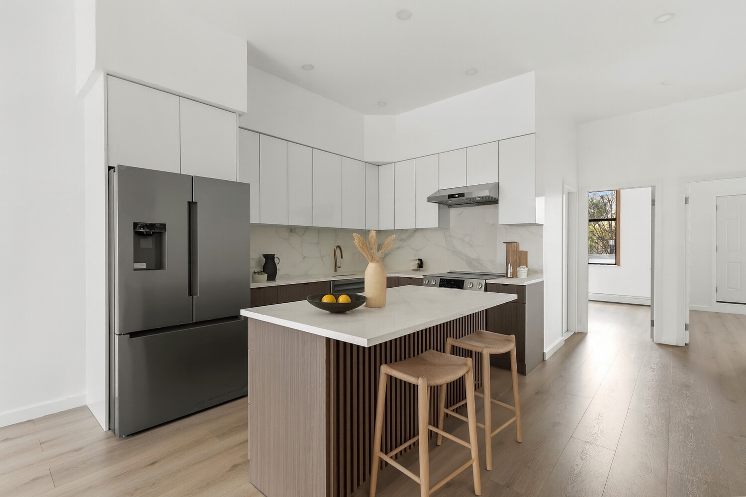 983 Manhattan Avenue, Unit 1 Brooklyn, NY 11222 - Photo 2 of 10 a kitchen with stainless steel appliances granite countertop a refrigerator a sink and a stove