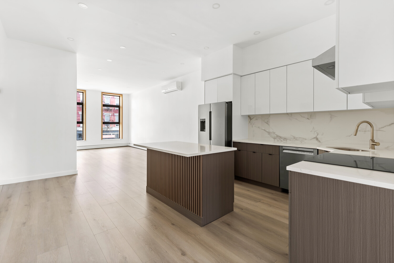 983 Manhattan Avenue, Unit 1 Brooklyn, NY 11222 - Photo 3 of 10 a kitchen with sink cabinets and wooden floor