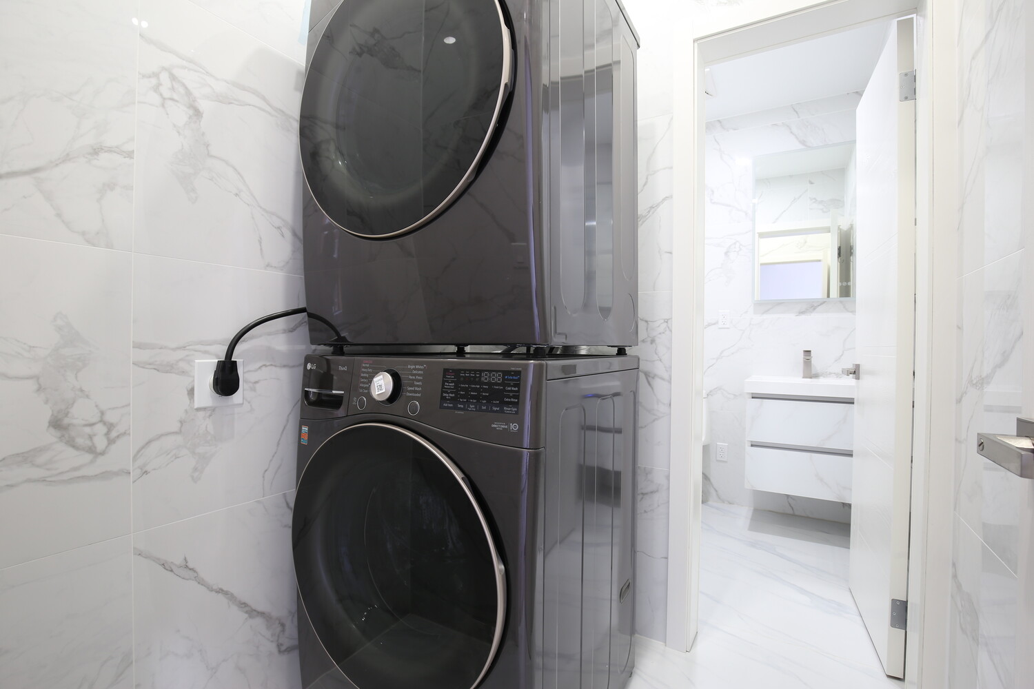 983 Manhattan Avenue, Unit 1 Brooklyn, NY 11222 - Photo 7 of 10 a close view of a utility room with dryer and washer
