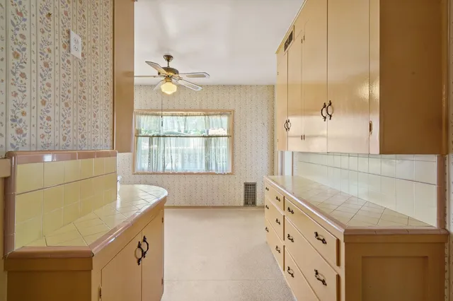 a view of a storage and utility room with washer and dryer