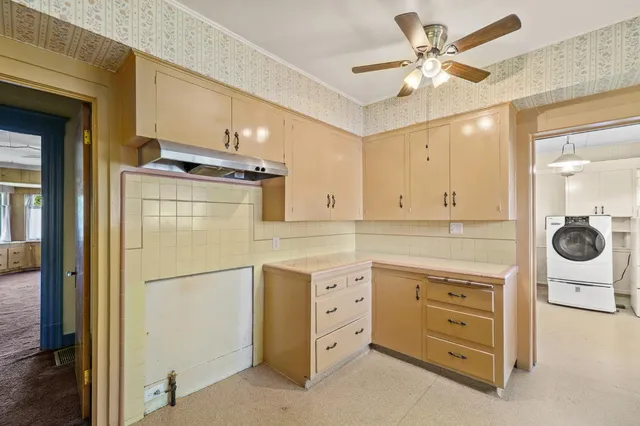 a view of a livingroom with wooden floor and a window