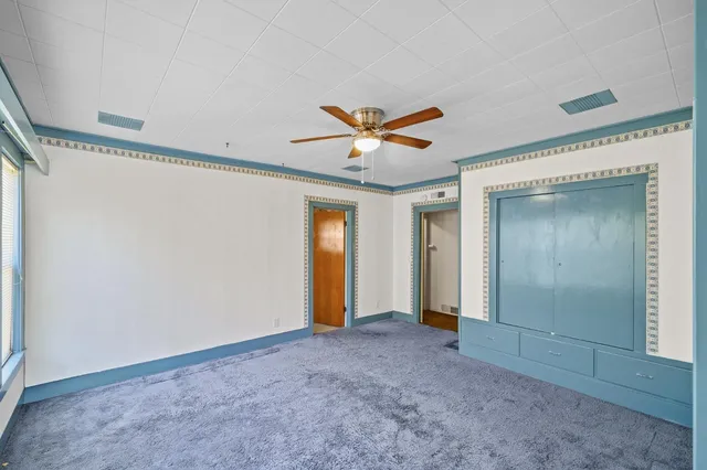 a bathroom with a sink a mirror and shower