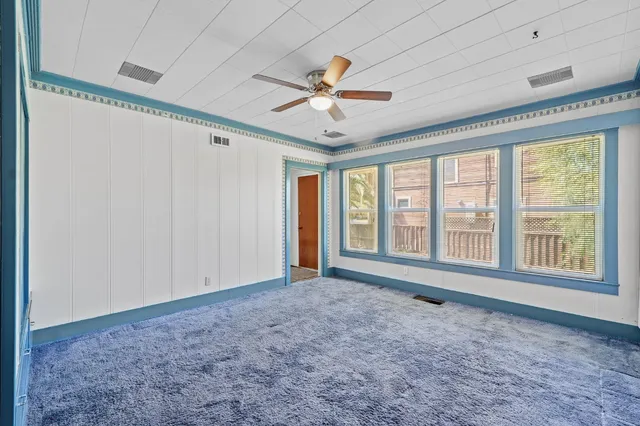 a view of room with cabinets and wooden floor