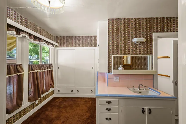 a kitchen with a stove and cabinets