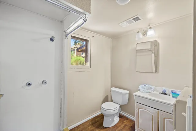 an aerial view of a house with a yard and garden