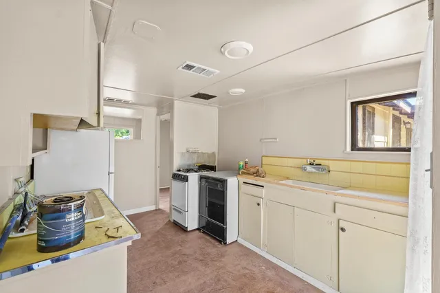 an aerial view of a house with a yard and garage