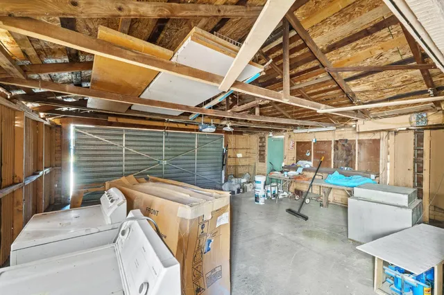 an aerial view of a house with yard and mountain view