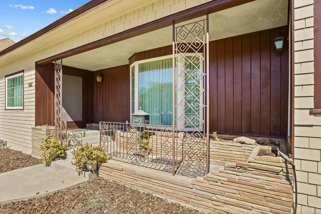 an empty room with windows and painted walls