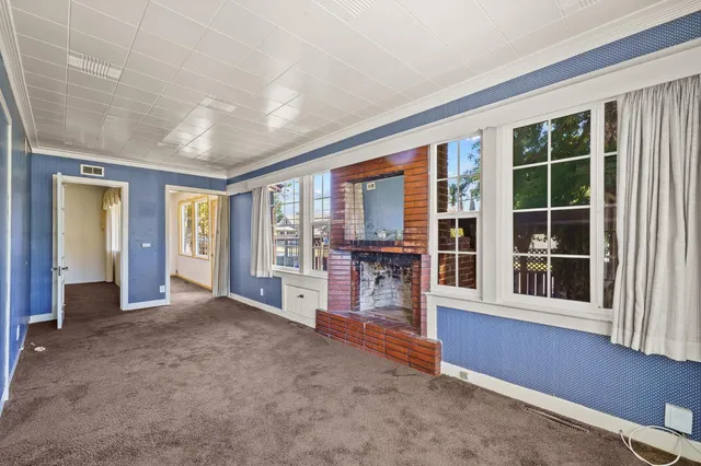 a kitchen with a stove a sink and a window
