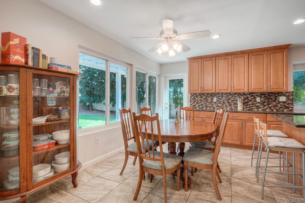 13639 Freeport Road San Diego, CA 92129 - Photo 14 of 44 a view of a dining room with furniture and a chandelier