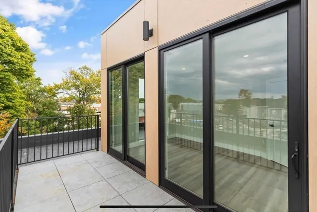 a view of a glass door with a balcony
