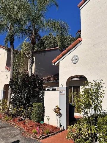 a view of a house with a tree