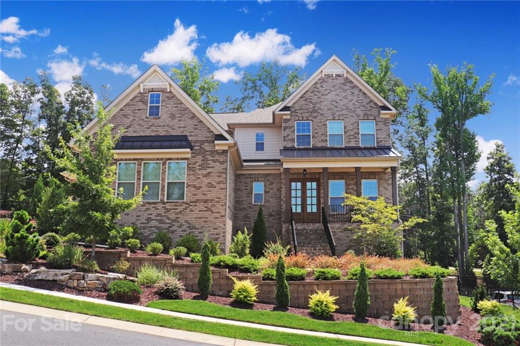 620 Zinnia Way Tega Cay, SC 29708 - Photo 1 of 39 a front view of a house with garden