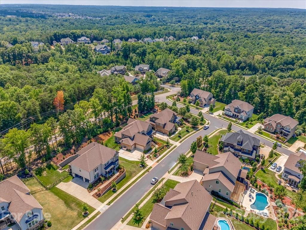 620 Zinnia Way Tega Cay, SC 29708 - Photo 3 of 39 an aerial view of a houses with a lush green hillside