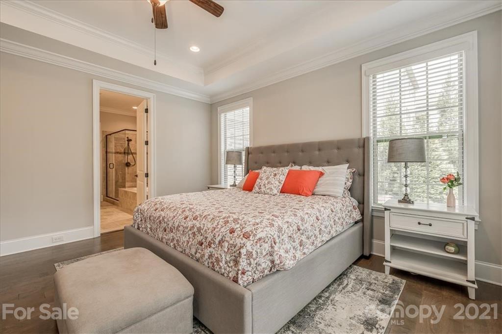 620 Zinnia Way Tega Cay, SC 29708 - Photo 21 of 39 a bedroom with a large bed and a dresser