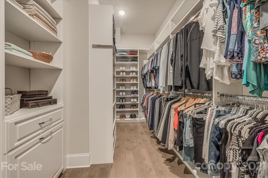 620 Zinnia Way Tega Cay, SC 29708 - Photo 23 of 39 a view of walk in closet with clothes and shoes