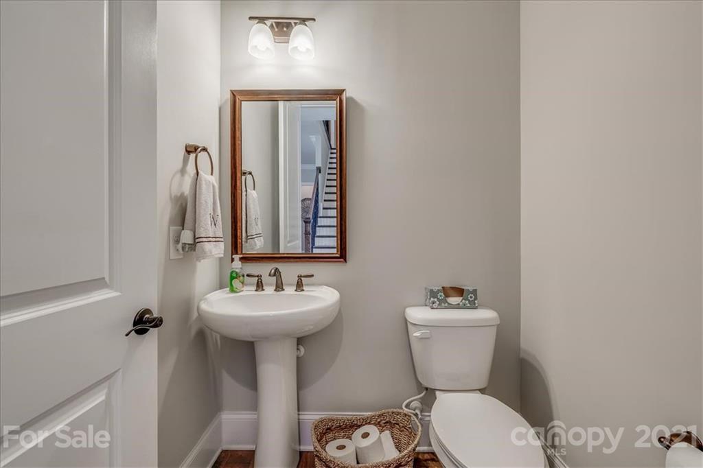 620 Zinnia Way Tega Cay, SC 29708 - Photo 24 of 39 a bathroom with a sink mirror and toilet