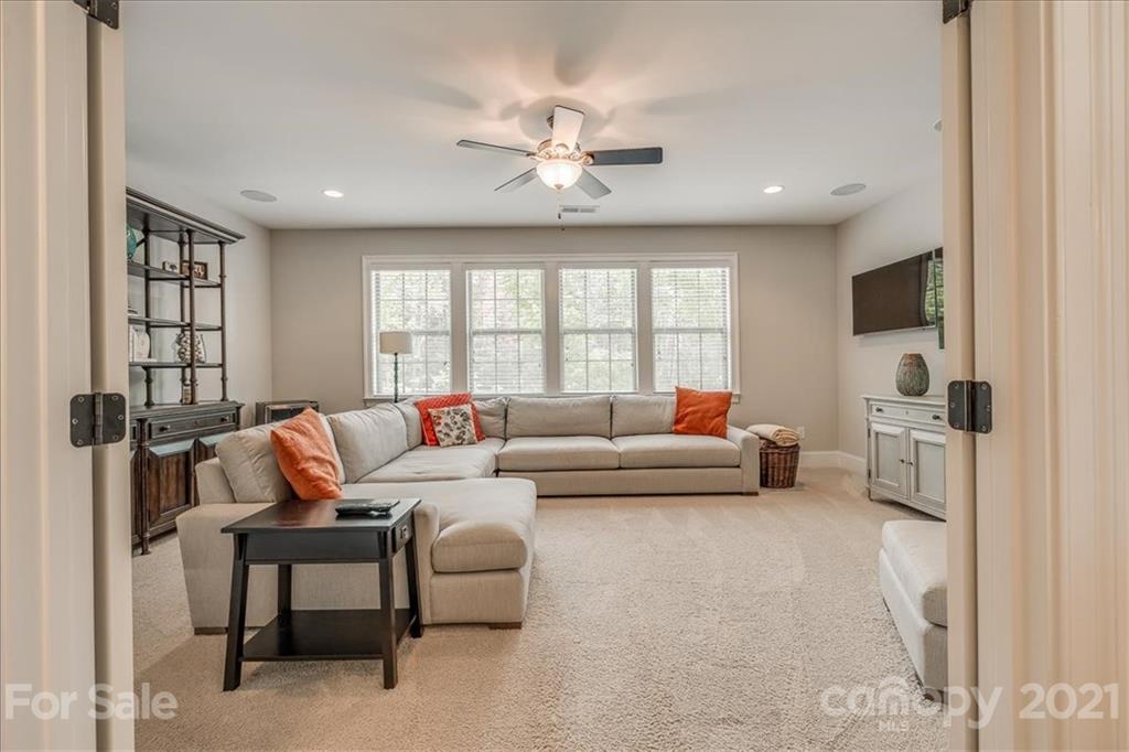 620 Zinnia Way Tega Cay, SC 29708 - Photo 25 of 39 a living room with furniture and a large window
