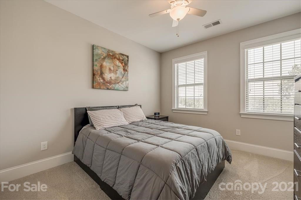 620 Zinnia Way Tega Cay, SC 29708 - Photo 29 of 39 a bedroom with a bed and a window