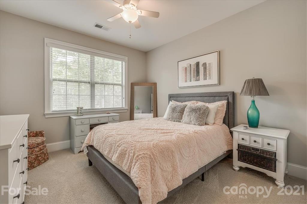 620 Zinnia Way Tega Cay, SC 29708 - Photo 31 of 39 a bedroom with a bed and a window