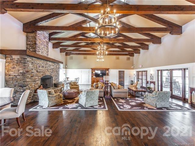 620 Zinnia Way Tega Cay, SC 29708 - Photo 35 of 39 a living room with lots of furniture and a fireplace