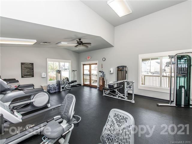 620 Zinnia Way Tega Cay, SC 29708 - Photo 38 of 39 a view of a livingroom with furniture hardwood floor and a large window