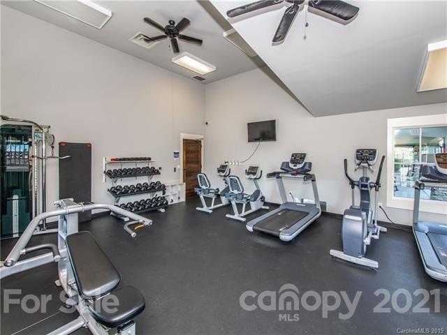620 Zinnia Way Tega Cay, SC 29708 - Photo 39 of 39 a room with gym equipment and a view of living room