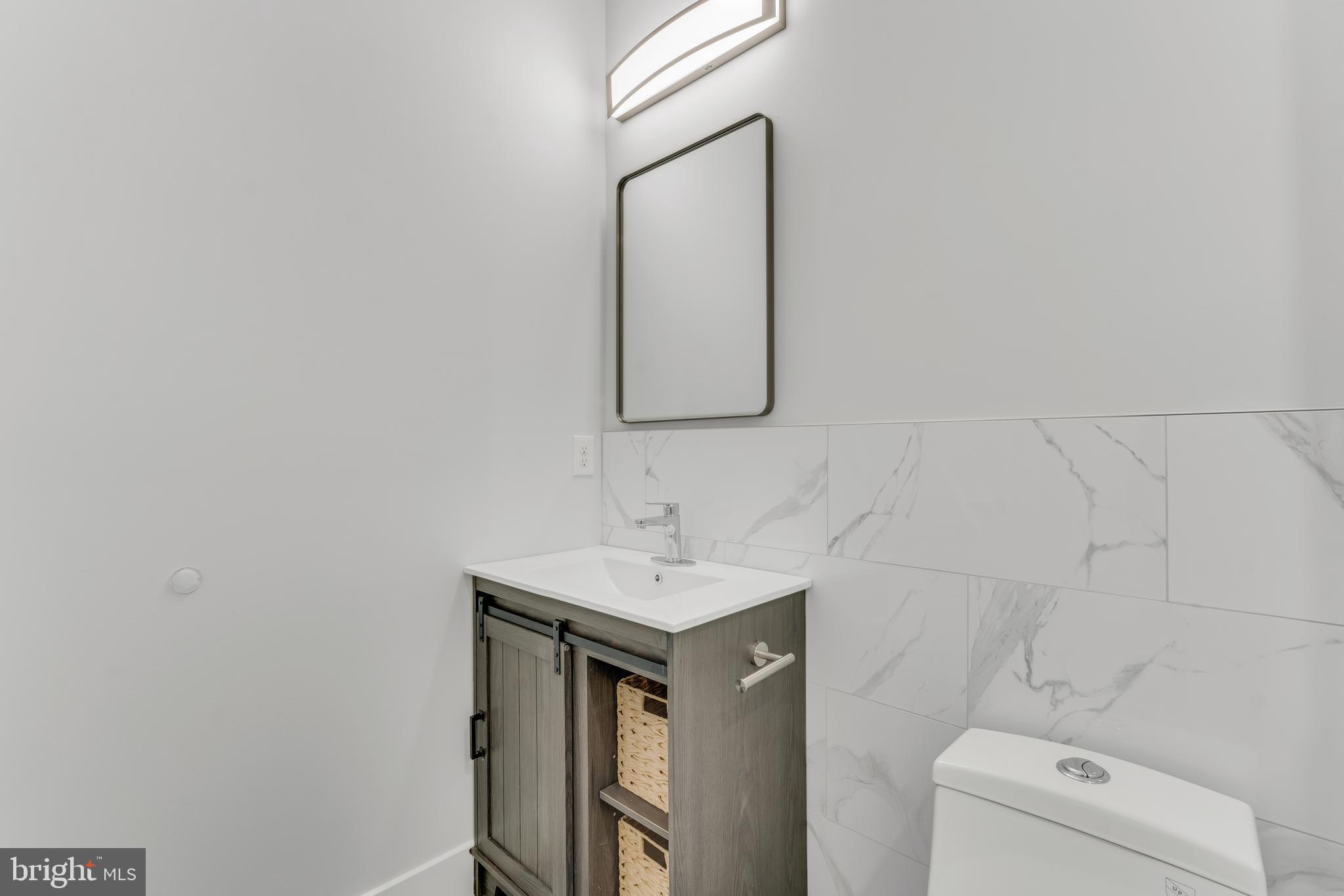 1243 West Westmoreland Street, Unit 2 Philadelphia, PA 19140 - Photo 13 of 18 a bathroom with a sink and a toilet