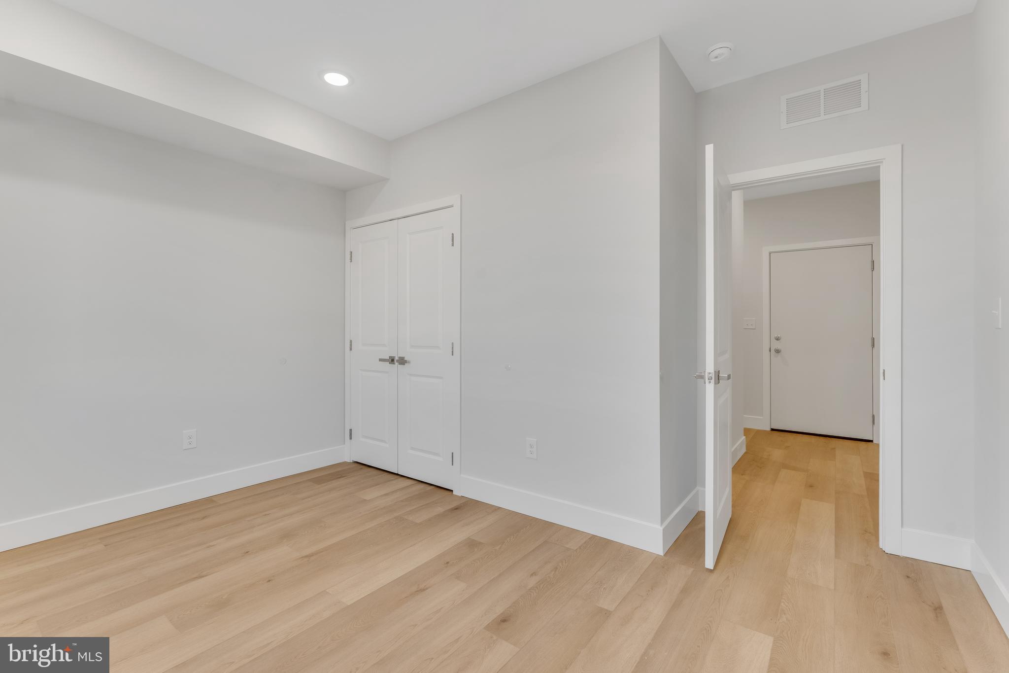 1243 West Westmoreland Street, Unit 2 Philadelphia, PA 19140 - Photo 15 of 18 wooden floor in an empty room