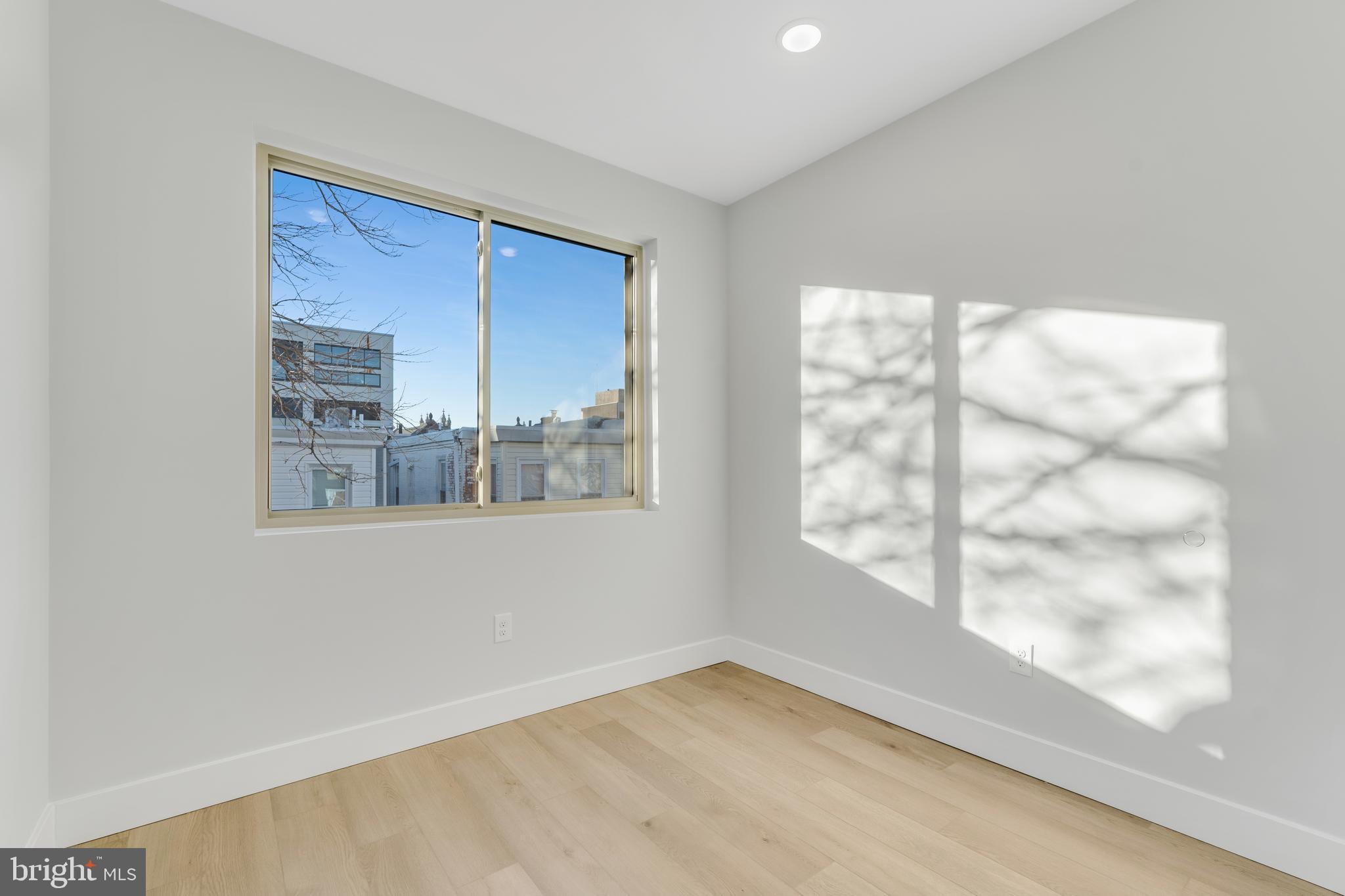 1243 West Westmoreland Street, Unit 2 Philadelphia, PA 19140 - Photo 10 of 18 a view of an empty room with a window