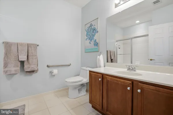 a bathroom with a sink toilet and mirror