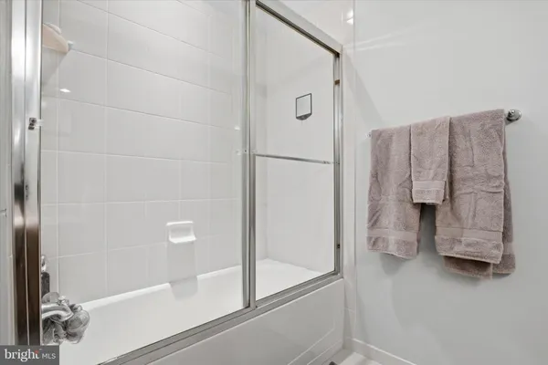 a bathroom with a tub and a shower