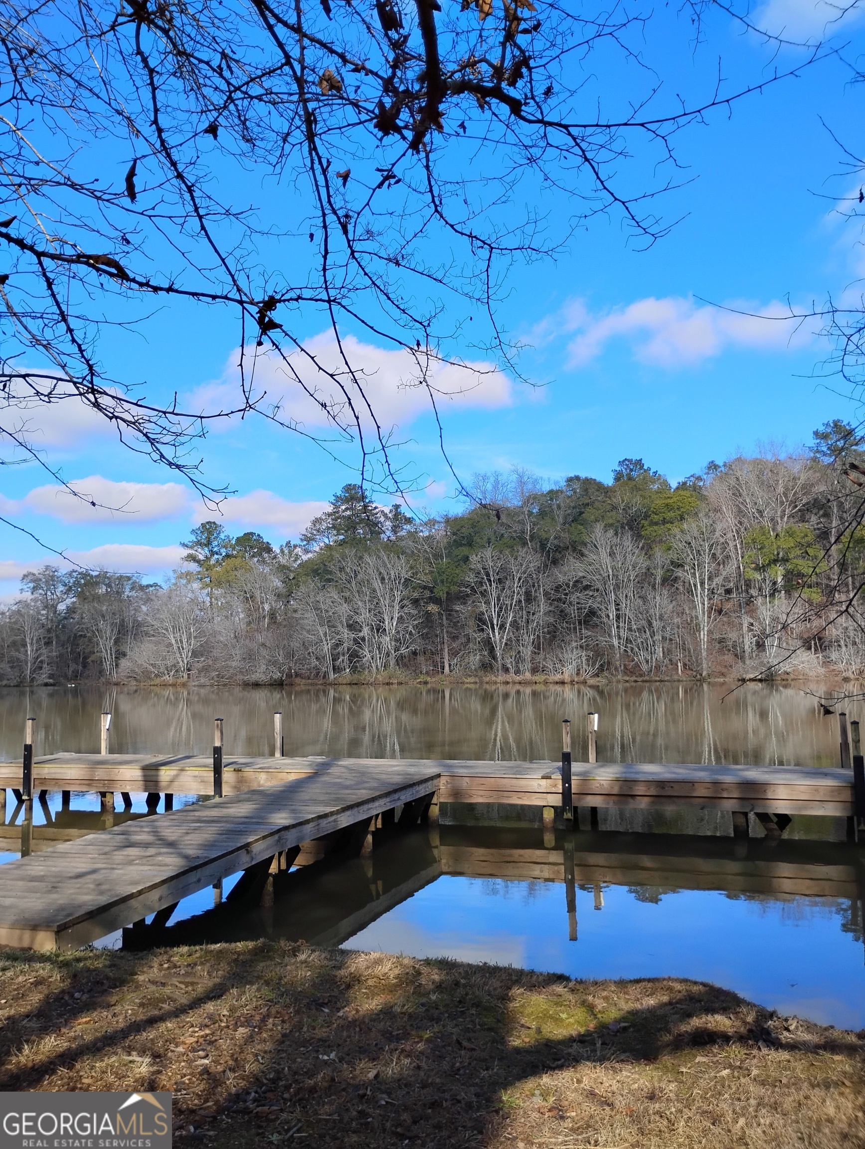 1220 Waterstone Drive Madison, GA 30650 - Photo 1 of 1 a view of a lake with mountain view