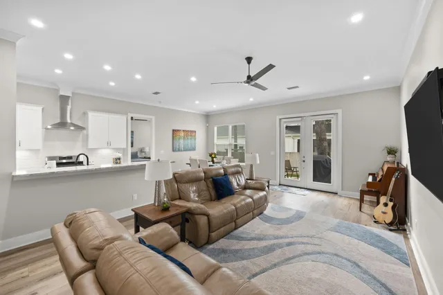 a kitchen with a sink stove top oven and refrigerator
