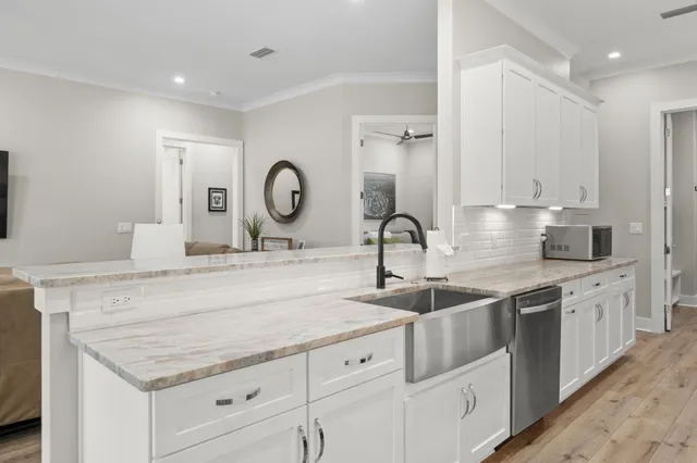 a bedroom with a bed and a flat tv screen