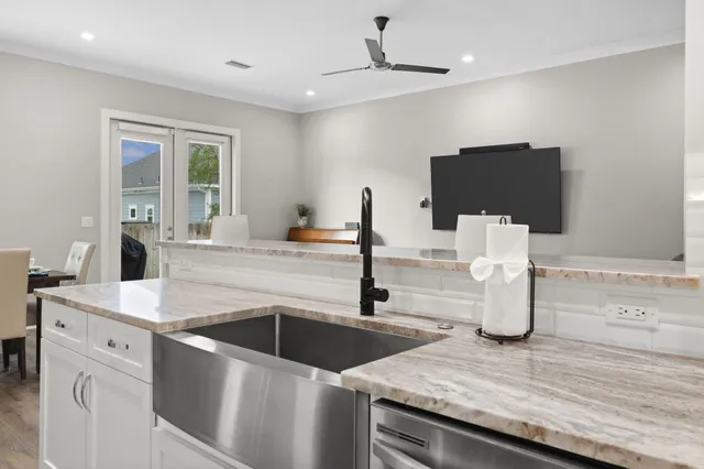 a bathroom with a granite countertop sink double and a mirror