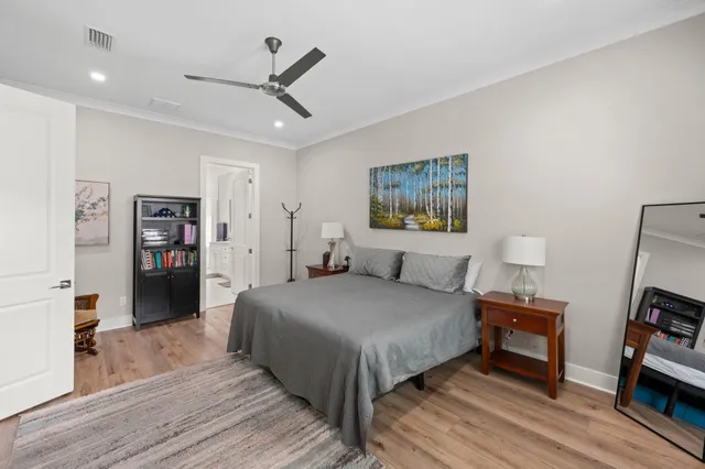 a bathroom with a granite countertop sink a toilet and a mirror