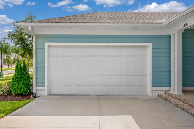 a view of two chairs in the patio