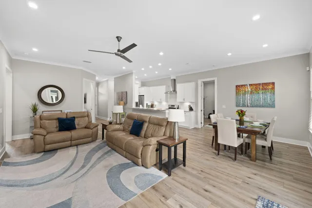 a kitchen with stainless steel appliances granite countertop a sink a stove and a refrigerator