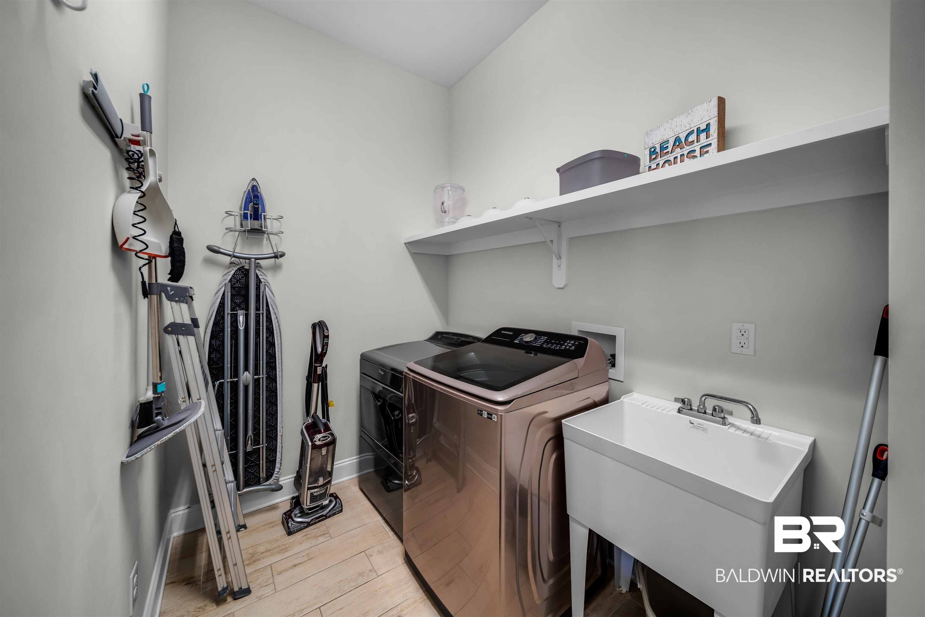 47 Parks Edge Orange Beach, AL 36561 - Photo 15 of 40 Laundry room featuring washing machine and clothes dryer and light wood-style floors