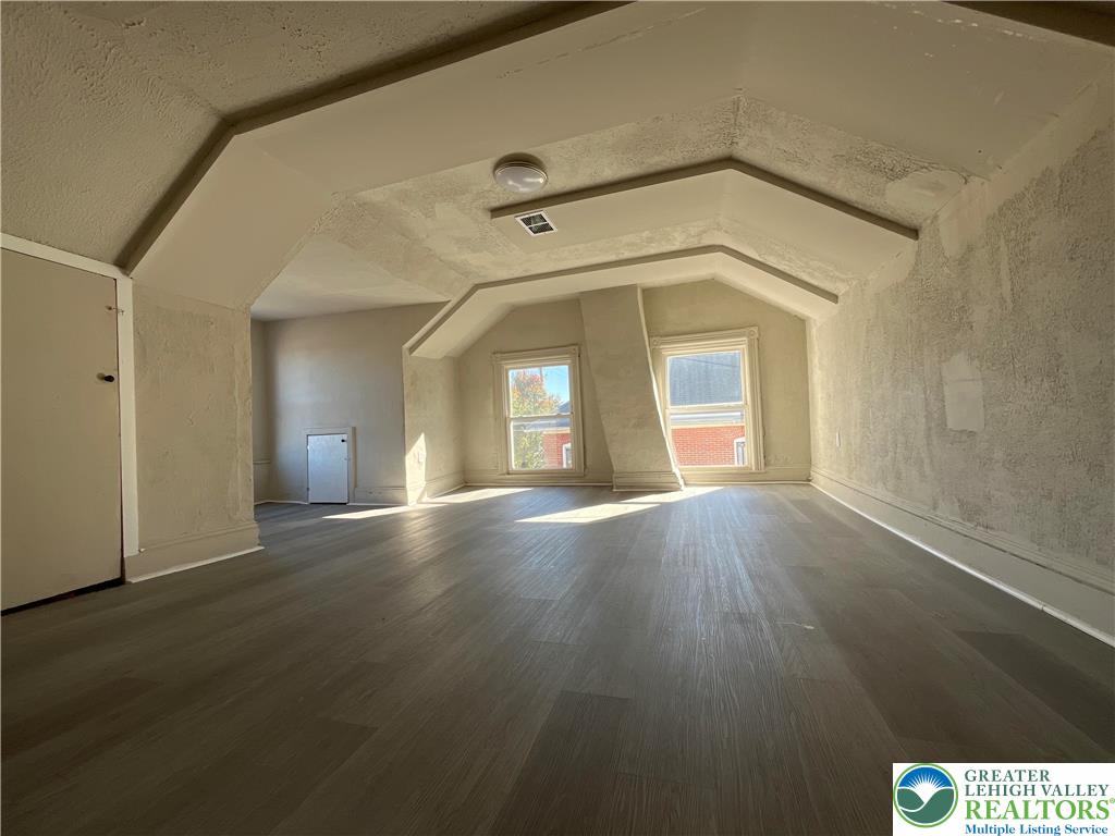 25 South 13th Street, Unit 2 Easton, PA 18042 - Photo 12 of 16 a view of a big room with wooden floor and windows