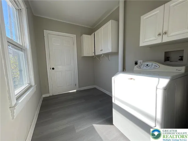 a utility room with dryer and washer