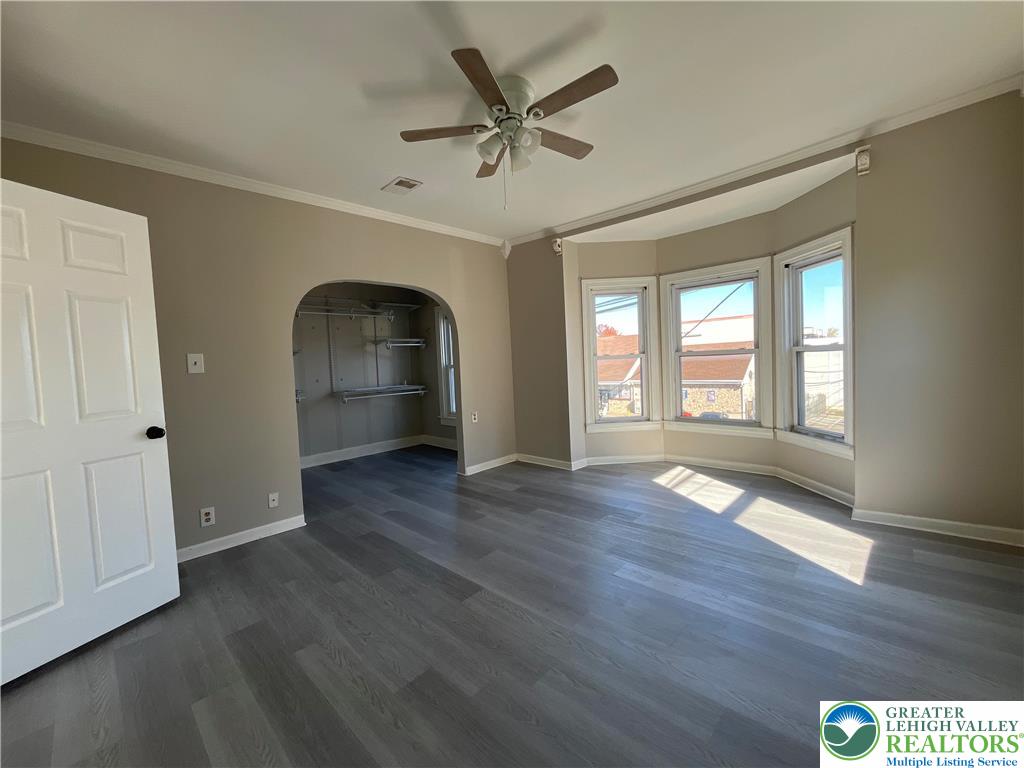 25 South 13th Street, Unit 2 Easton, PA 18042 - Photo 6 of 16 wooden floor in an empty room with a window