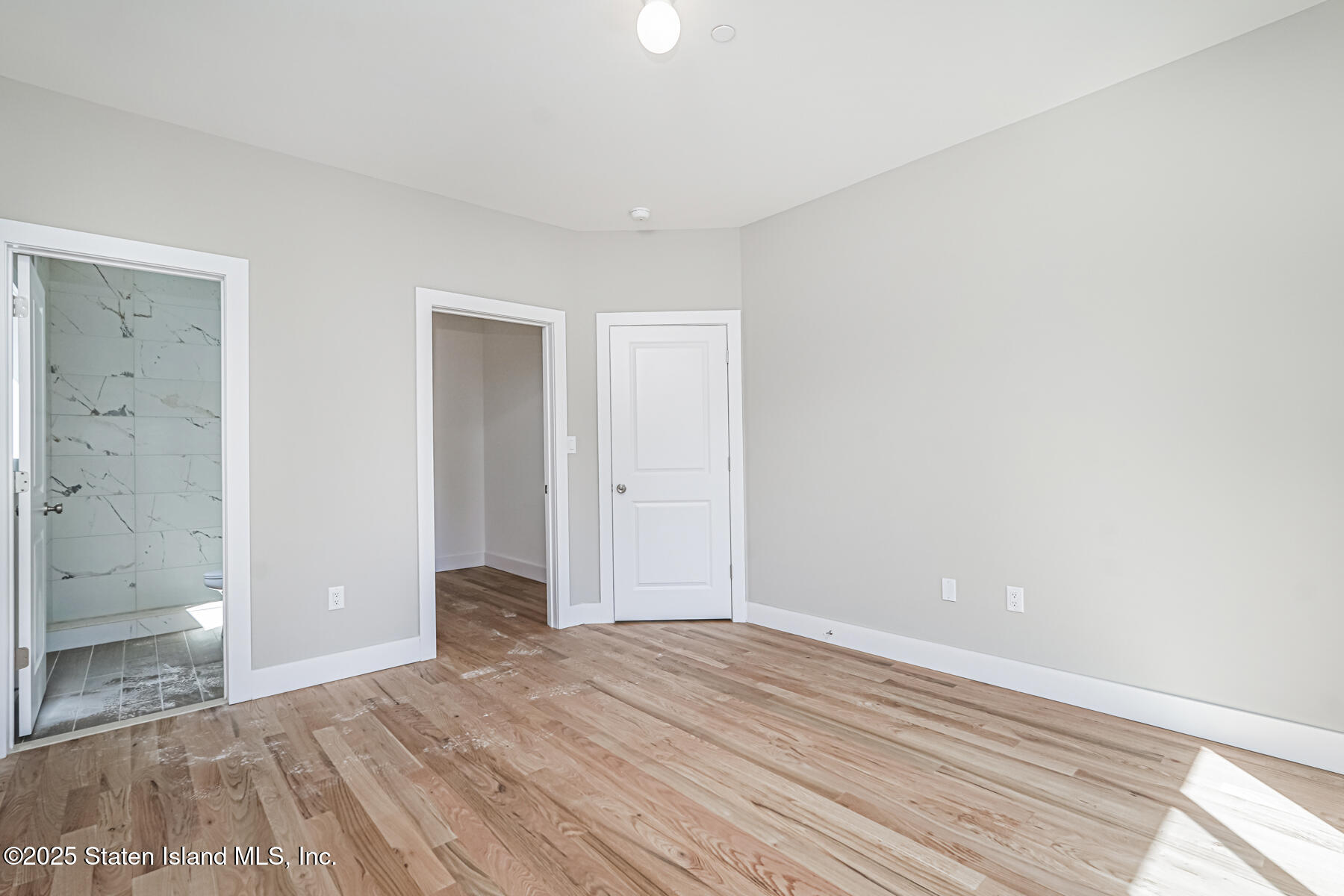 291 Rensselaer Avenue Staten Island, NY 10312 - Photo 17 of 38 a view of a big room with wooden floor and windows